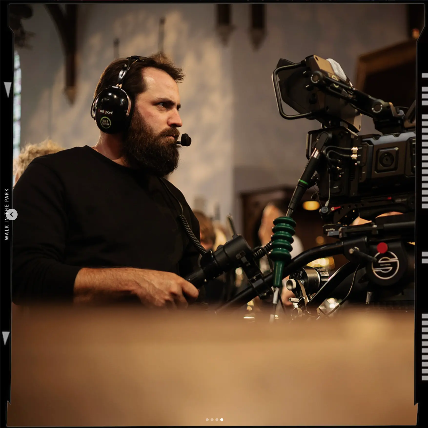 Cameraman on a pedestal during a church concert registration